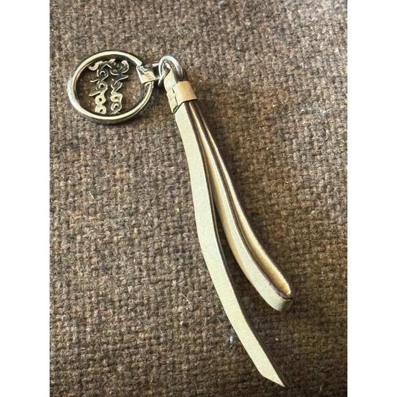 Coach Accessories - Coach Poppy Metallic Gold Leather Tassel Keychain Silver Heart Logo Bag Charm